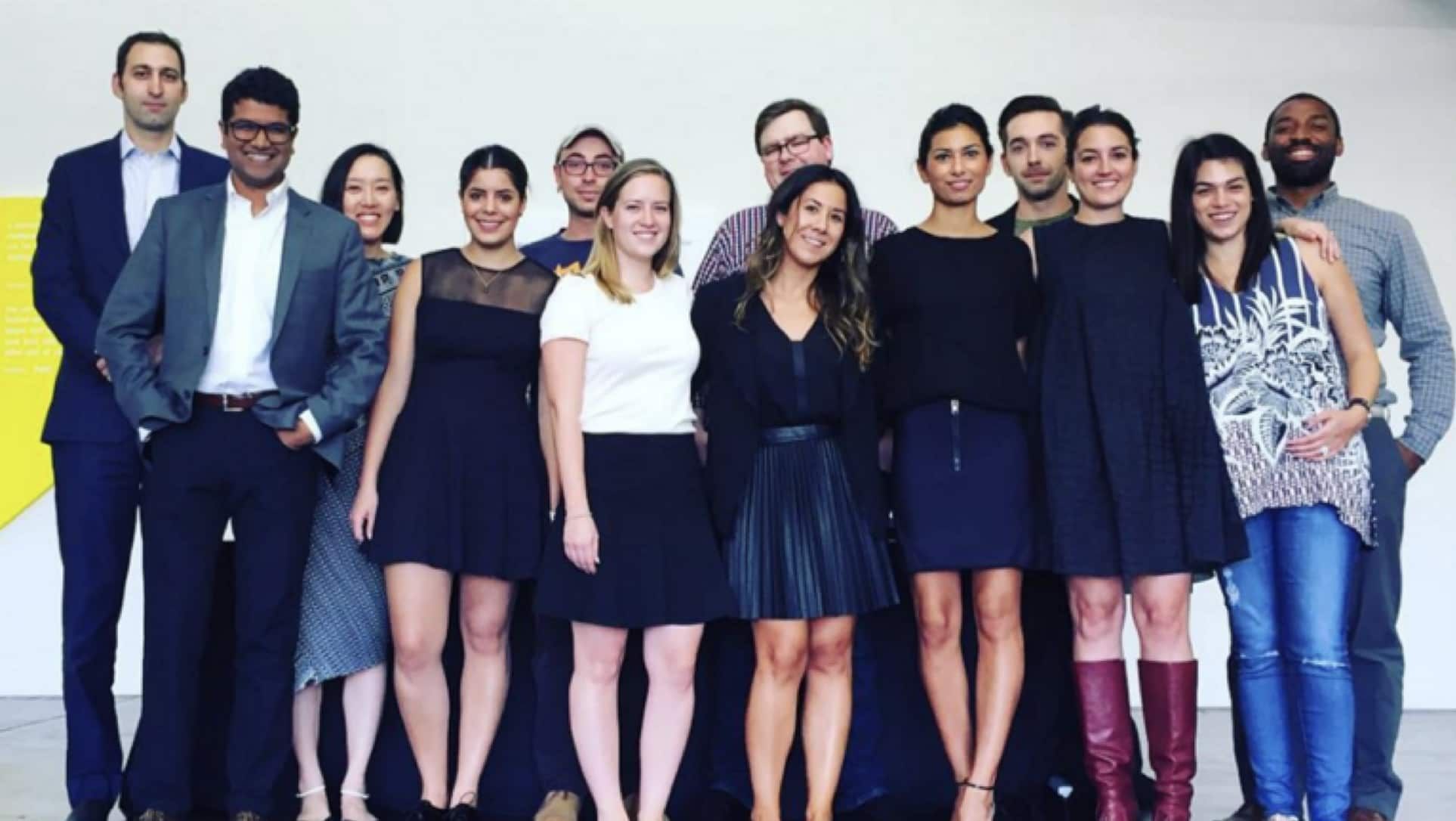 Photo of a group of people in what looks like an art gallery, with me in the back