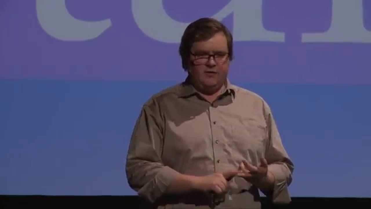 Photo of me presenting at a conference