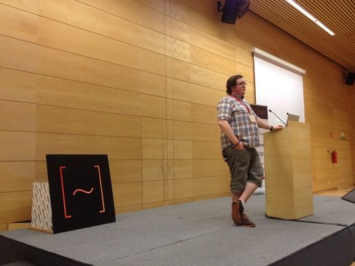Photo of me looking nonchalant on a large stage.